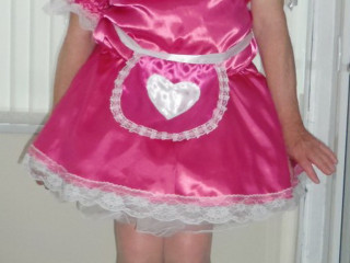 Sissy Charlotte Pink Maid with her knees tight together