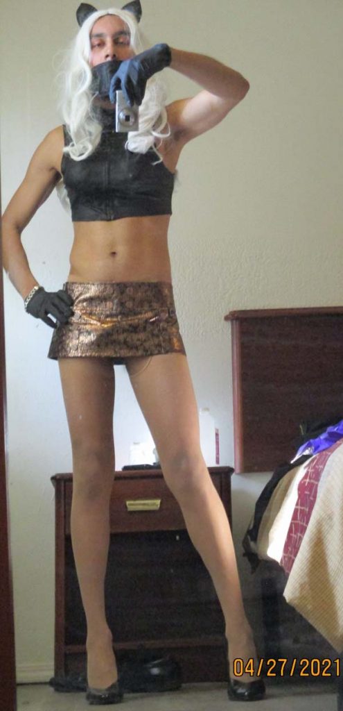 stilettogenie-standing-in-a-miniskirt-and-heels-495x1024